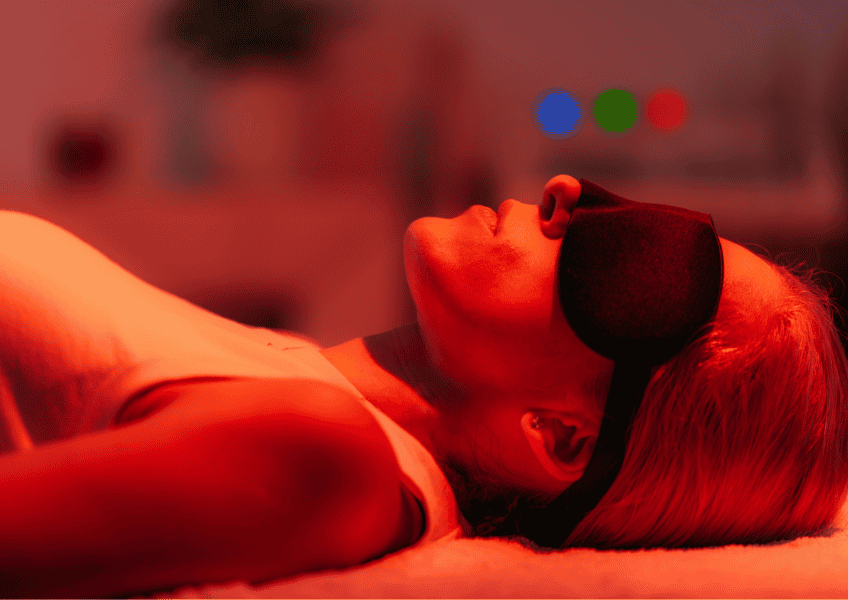 Woman undergoing red light therapy.